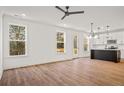 Spacious living room with hardwood floors and access to deck at 423 Grove End Rd, Moncks Corner, SC 29461