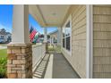 Covered front porch with stone pillars and railing at 516 Yellow Leaf Ln, Summerville, SC 29486