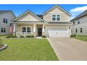 Two-story home with a landscaped yard and driveway at 516 Yellow Leaf Ln, Summerville, SC 29486