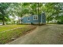 Blue house with a wooden porch and a grassy yard at 2355 Cambridge Ave, North Charleston, SC 29405