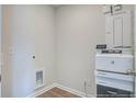 Small laundry area with a built-in shelf and space for a washer and dryer at 2332 Macallan Blvd, Ravenel, SC 29470