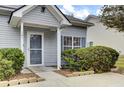 Grey house with blue shutters and storm door at 161 Townsend Way, Summerville, SC 29483