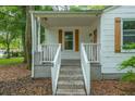 Front porch with white railings and steps at 3981 Niagara St, North Charleston, SC 29405