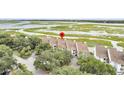 Aerial view showcasing waterfront townhome community at 250 Little Oak Dr # 250, Folly Beach, SC 29439