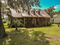 Brick house with metal roof, large porch, and spacious yard at 1813 Albert Storm Ave, Moncks Corner, SC 29461
