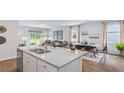 Modern kitchen island with granite countertops and stainless steel sink at 357 Willows Crescent Dr, Moncks Corner, SC 29461