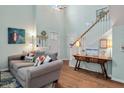 Living room with light walls, hardwood floors, comfortable sofas, and a decorative rug at 1229 Updyke Dr, Johns Island, SC 29455