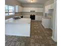 Spacious kitchen featuring white cabinets and a large island at 8508 Stonebridge Dr, North Charleston, SC 29420