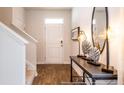 Bright entryway with hardwood floors and a modern console table at 353 Willows Crescent Way, Moncks Corner, SC 29461