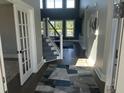 Bright and airy entryway with hardwood floors and a staircase at 174 Whaler Ave, Summerville, SC 29486