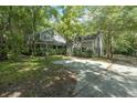 Two-story house with attached garage, surrounded by lush greenery at 200 Old Postern Rd, Summerville, SC 29483