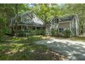 Two-story house with attached garage, surrounded by lush greenery at 200 Old Postern Rd, Summerville, SC 29483