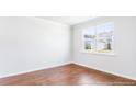 Bright office space with hardwood floors and a large window at 281 Blue Haw Dr, Moncks Corner, SC 29461