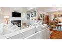 Spacious living room featuring white slipcovered sofas and a fireplace at 933 Mccants Dr, Mount Pleasant, SC 29464