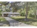 Charming brick home nestled on a tree-lined lot at 1510 Jahnz Ave, Summerville, SC 29485