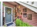 Inviting entryway with a gray door, wreath, and eclectic decor at 7940 Parklane Ct # A, North Charleston, SC 29418