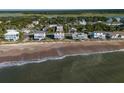 Beachfront property view showcasing home's location and proximity to the ocean at 144 Palmetto Blvd, Edisto Island, SC 29438