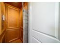 Wood-paneled elevator with metal gate at 3002 Palmetto Blvd # 6, Edisto Beach, SC 29438