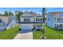 Two-story house with light gray siding, white trim and a two car garage at 601 Yellow Leaf Ln, Summerville, SC 29486
