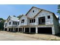 New townhome community under construction, featuring multiple units with attached garages at 420 Carolina Cherry Ct # 102, Charleston, SC 29414