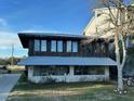 Unique waterfront home with expansive windows and metal roof at 924 W Oceanview Rd, Charleston, SC 29412