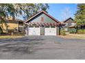 Two-car garage with pergola and architectural details at 5559 Colonial Chatsworth Cir, North Charleston, SC 29418