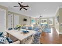 Bright living room with hardwood floors, comfortable seating, and large windows at 3238 Plow Ground Rd, Johns Island, SC 29455