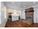 Living room with hardwood floors and exposed brick fireplace at 59 Ashe St, Charleston, SC 29403