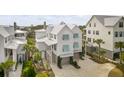 Aerial view of charming coastal home with detached garage at 9844 Haven Loop, Johns Island, SC 29455