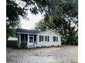 Charming ranch home with a screened porch and well-maintained landscaping at 7629 Pinehurst St, North Charleston, SC 29420