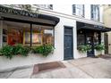 Commercial storefront featuring two businesses with window displays at 106 Church St # D, Charleston, SC 29401