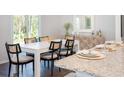 Dining area with a white table and black chairs near the kitchen at 509 Frutchey Ct, Summerville, SC 29486
