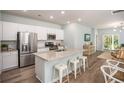 Modern kitchen with white cabinets, granite counters, stainless steel appliances, and an island at 211 Dean Hall Ave, Moncks Corner, SC 29461