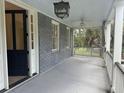 Spacious front porch with ceiling fan and view of lush greenery at 8 Maverick St, Charleston, SC 29403