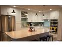Modern kitchen boasting white cabinets, stainless steel appliances, and a large island at 818 Club Cottage Court, Edisto Beach, SC 29438