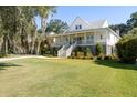 Elevated home with spacious porch and manicured lawn at 3583 Somerset Hills Ct, Mount Pleasant, SC 29466