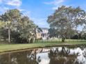 House with screened porch and pond view at 1000 Rivershore Rd, Charleston, SC 29492