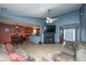 Living room with fireplace, two sofas, and a view of the dining area at 7201 Sweetgrass Blvd, Hanahan, SC 29410