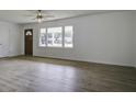 Bright living room with hardwood floors and large windows at 121 Matheny Dr, Goose Creek, SC 29445