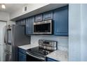 Modern kitchen with stainless steel appliances and white quartz countertops at 1481 Center Extension St # 208, Mount Pleasant, SC 29464
