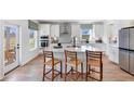 Modern kitchen with white cabinets, island, and stainless steel appliances at 164 Middleton Dr, Goose Creek, SC 29445