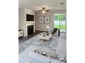 Spacious living room with fireplace and access to backyard at 3956 Treebranch Circle, Mount Pleasant, SC 29429