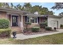 Brick ranch home with updated landscaping and walkway at 205 Whitesville Rd, Moncks Corner, SC 29461