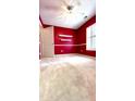 Red bedroom with carpet, ceiling fan, and white door at 106 Hardee Ave, Summerville, SC 29485