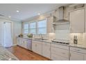 Modern kitchen featuring stainless steel appliances and white cabinetry at 620 Chigwell Springs Ln, Summerville, SC 29486