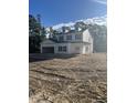 Two-story house with white siding, black shutters, and a two-car garage at 310 Mizell Rd, Dorchester, SC 29437