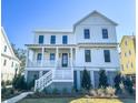 Two-story home with white siding and gray accents at 1467 Jeremy Cay Ct, Awendaw, SC 29429
