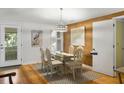 Coastal dining area with glass table and white chairs at 1101 Summerwind Ln, Seabrook Island, SC 29455