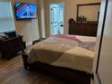 Spacious bedroom with a large bed, TV and ensuite bathroom at 5309 Good St, North Charleston, SC 29406