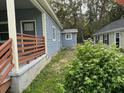 Charming house exterior with a covered porch and side yard at 5309 Good St, North Charleston, SC 29406